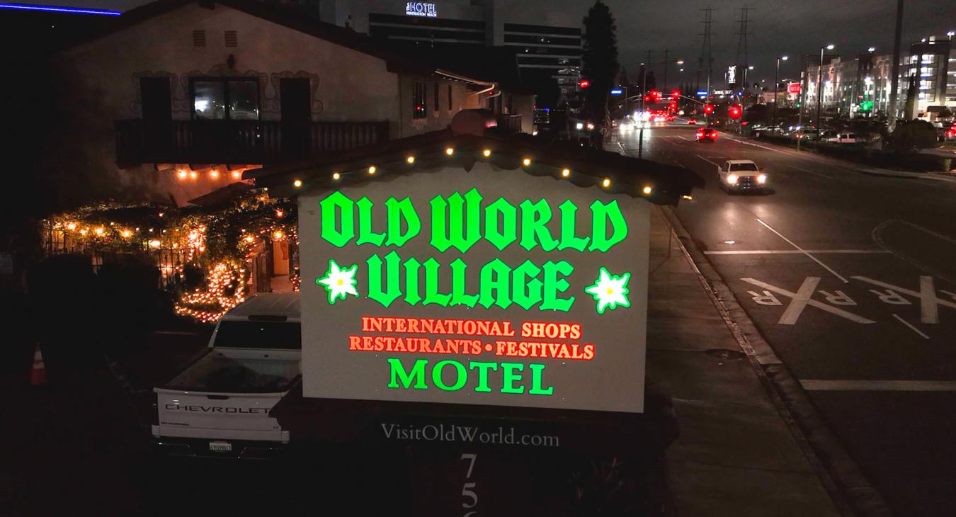 The Old World Village Sign
